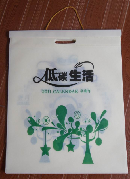 無(wú)紡布袋掛歷批發(fā)，無(wú)紡布掛歷訂做廠家